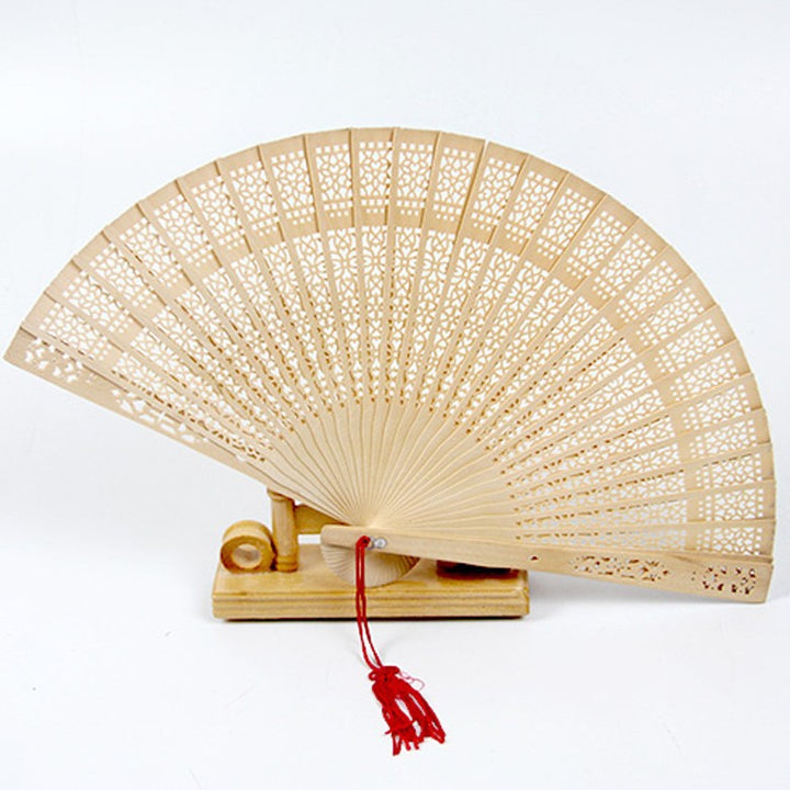 Ladies fan made of delicate plastic with artistic cut pattern Bowlift