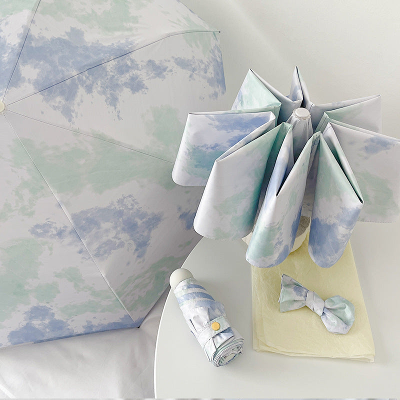 Ladies elegant folding umbrella with modern cloud pattern Bowlift