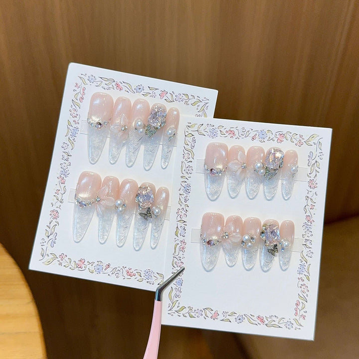 Artificial nails with delicate glitter and pearl decoration Bowlift