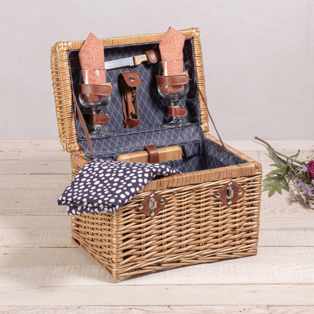 Ladies picnic basket with stylish glasses and wooden boards Bowlift