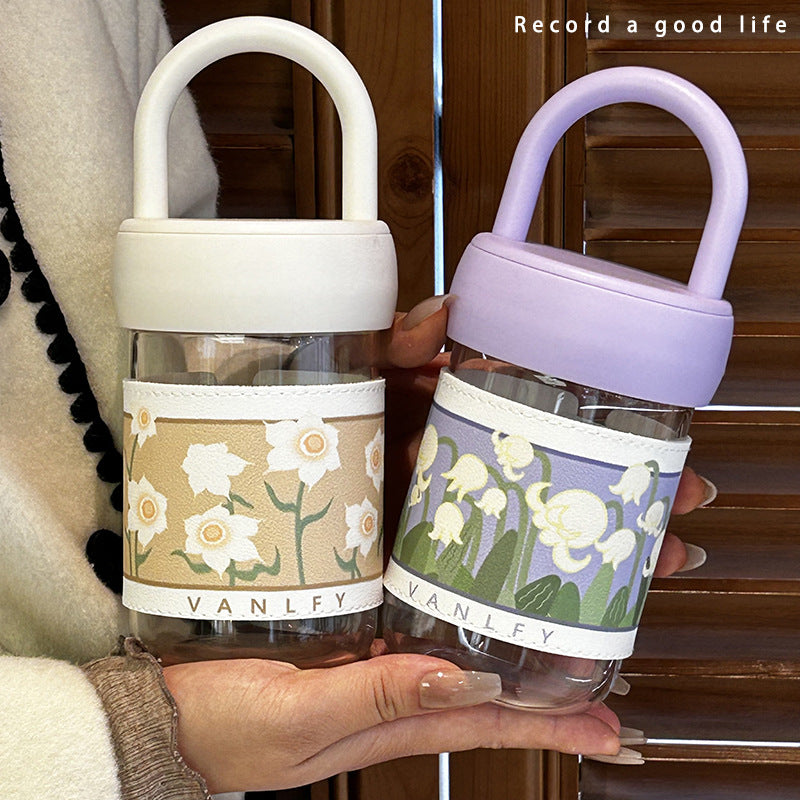 Women's insulated drinking bottle with ergonomic carrying handle and elegant flower design Bowlift