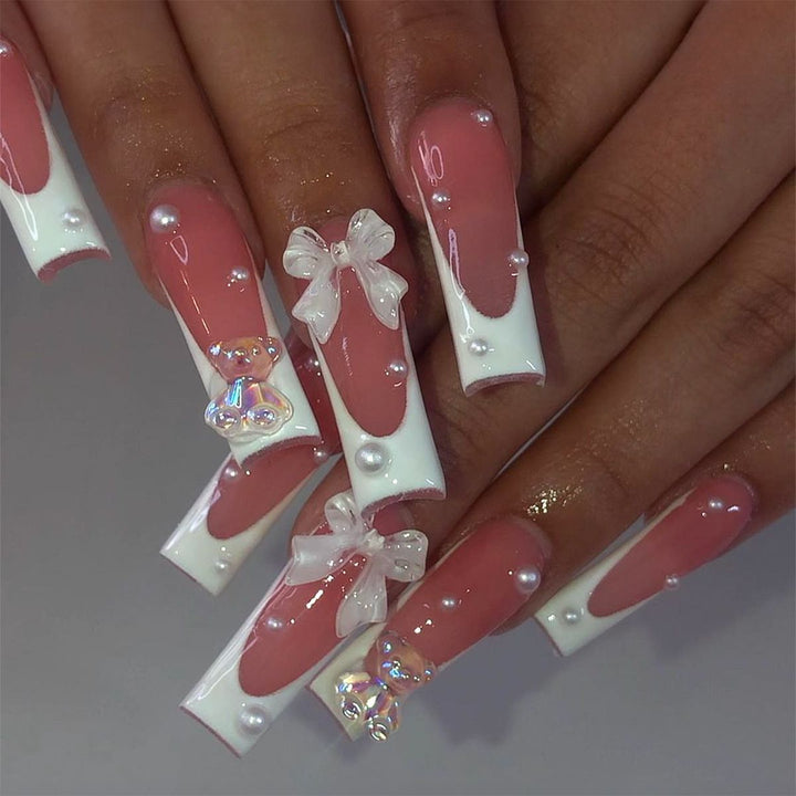 Elegant artificial nails with delicate bows and pearls Bowlift