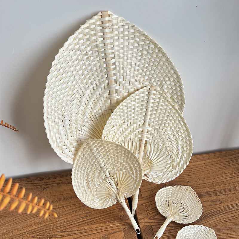 Women hand-woven fan made of natural material Bowlift
