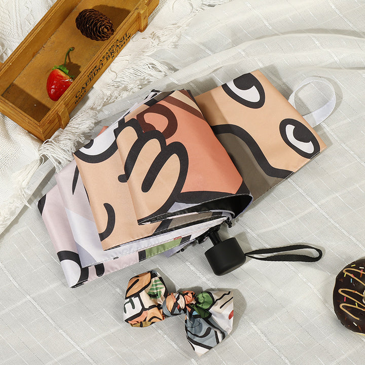 Women's folding umbrella with colorful animal design and durable frame Bowlift