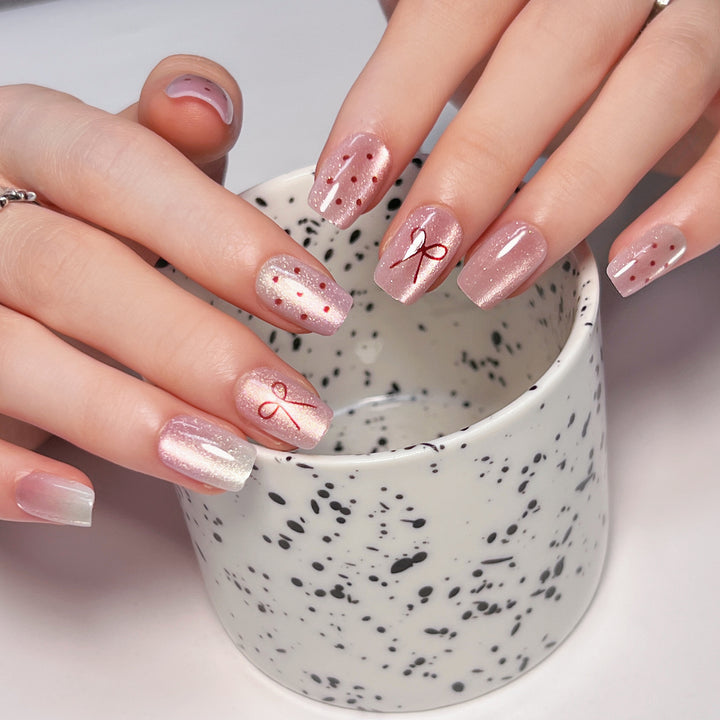 Artificial nail art with cute bow design Bowlift