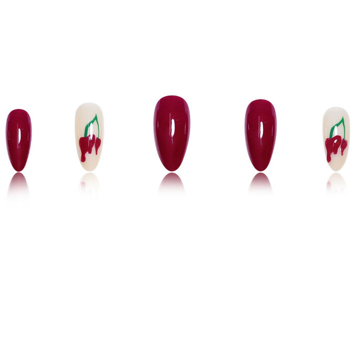 Artistic Press-On Nail Extensions with Cherry Design Bowlift