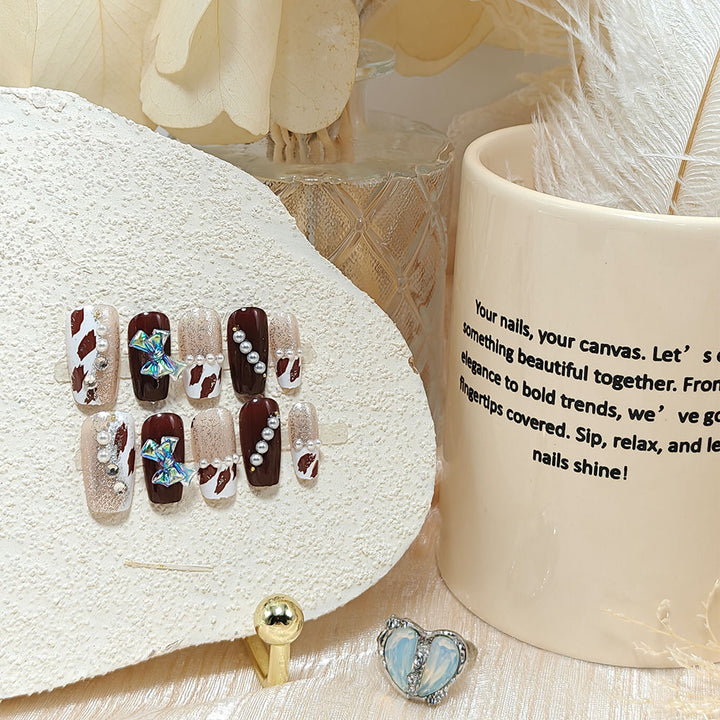 Artificial nails with glamorous rhinestone and bow design Bowlift