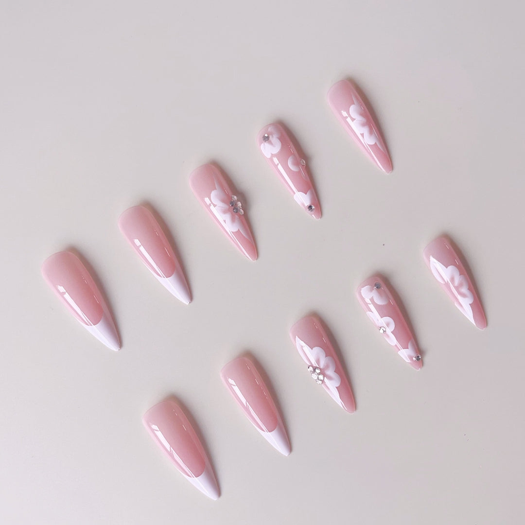 Elegant artificial nail set with floral design and glitter accents Bowlift