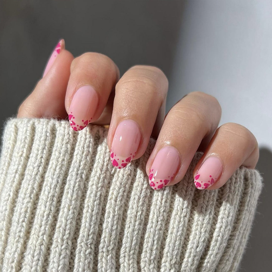 Artificial nail extensions with heart tip accents Bowlift