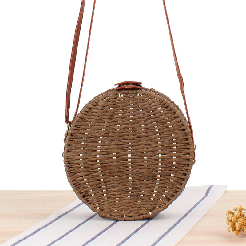 Round basket bag with leather accents Bowlift