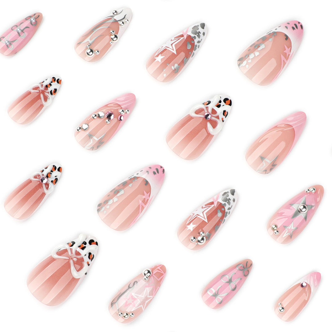 Artful stiletto nails with glitter and bow decorations Bowlift