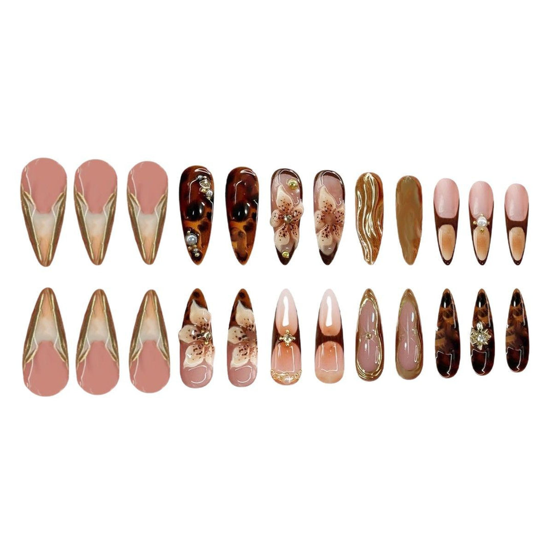 Artistic Stiletto Press-On Nail Art with Floral and Gemstone Accents Bowlift