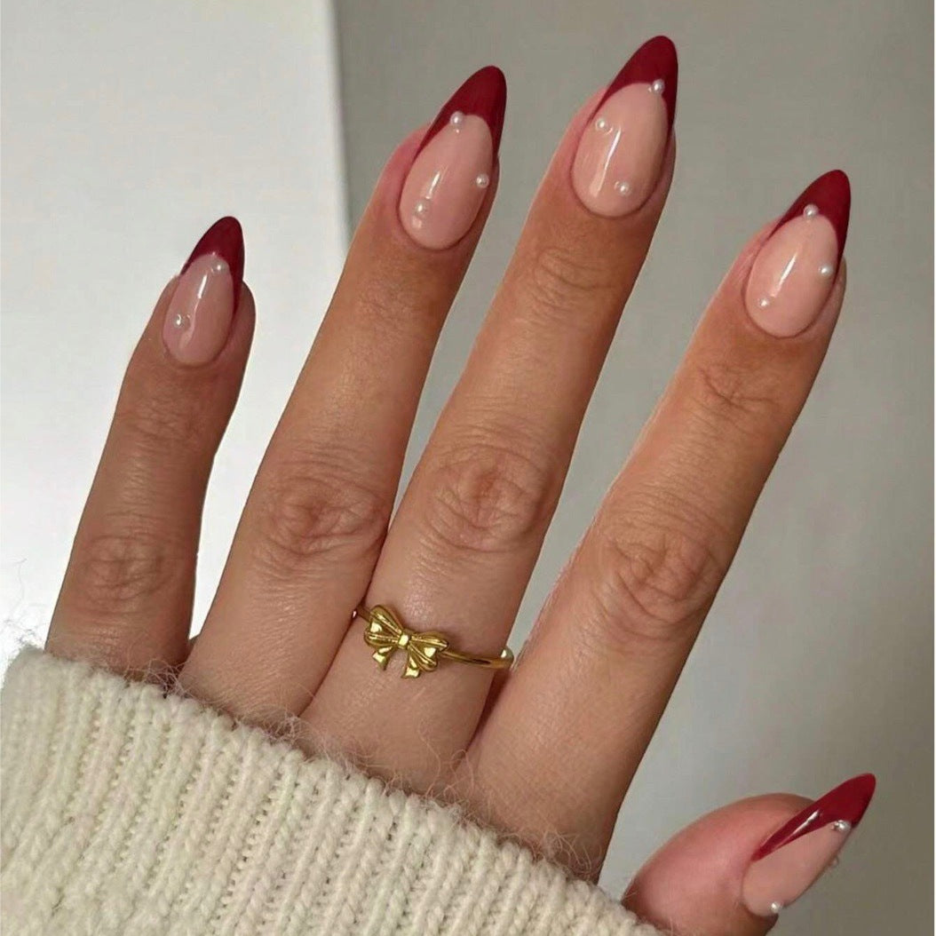 Acrylic nail set with elegant spike design and shimmering accents Bowlift
