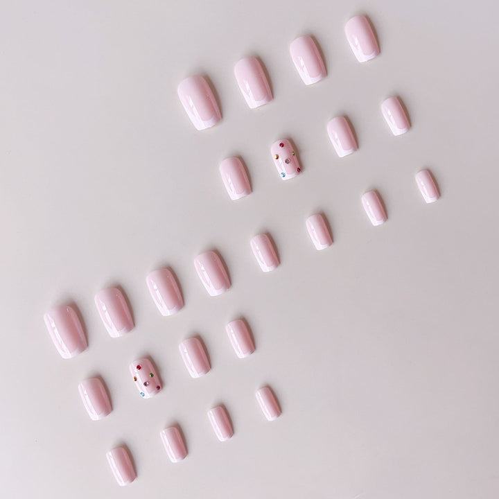 Nail art set with elegant French tips and sparkling rhinestone embellishments Bowlift