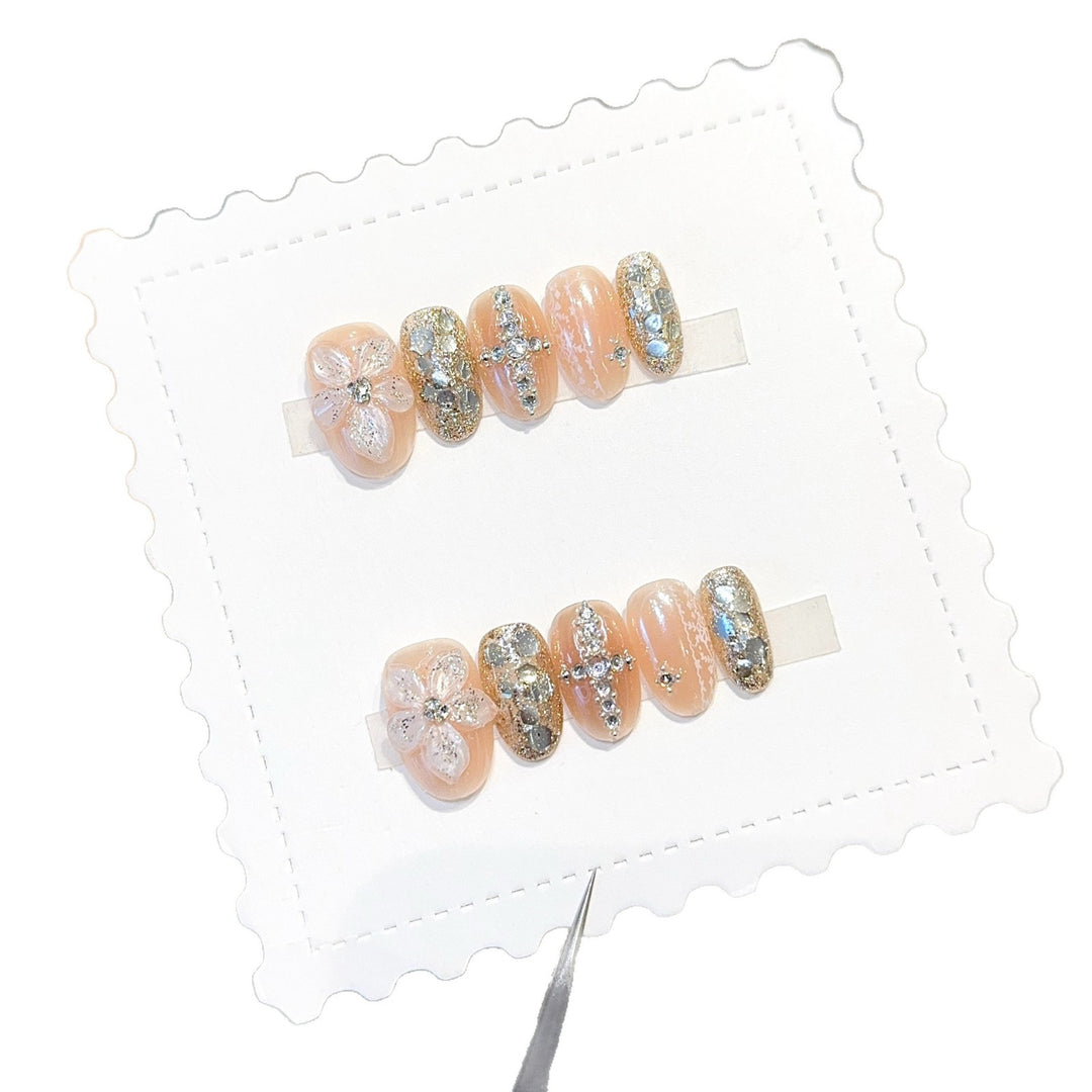 Glamorous artificial nails with floral and glittering accents Bowlift