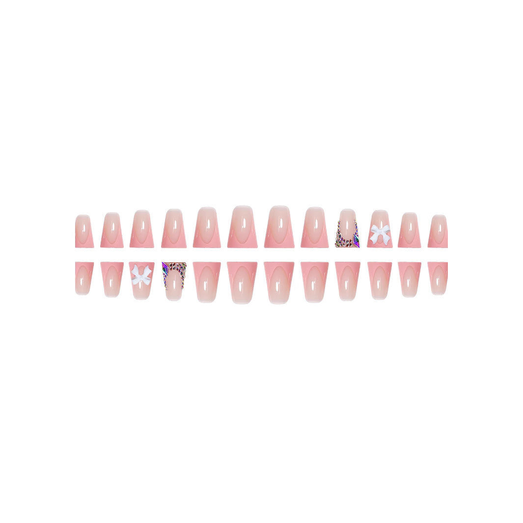 Decorative Acrylic Nail Enhancements with Bow and Rhinestone Accents Bowlift