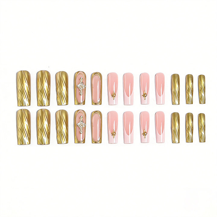 Acrylic nail set with elegant golden embellishments and glamorous accents Bowlift