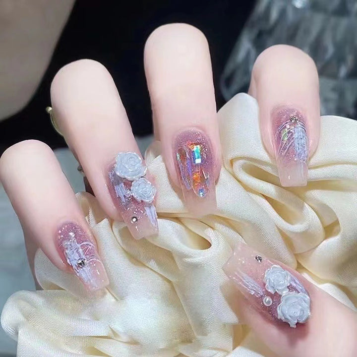 Artistic nail art with floral embellishments Bowlift
