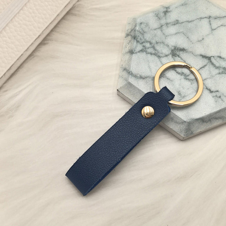 Unisex keychain made of high-quality synthetic leather with elegant metal embellishment Bowlift