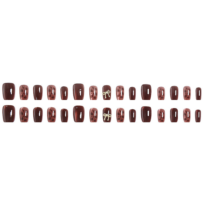 Nail set with elegant leopard pattern and luxurious accents Bowlift