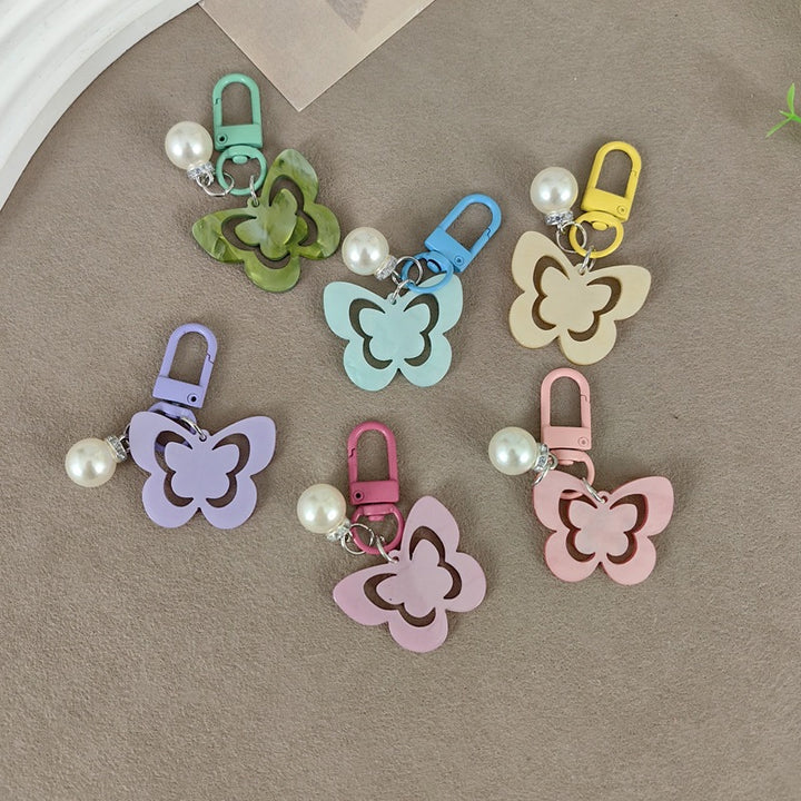 Keychain with butterfly and pearl accent Bowlift