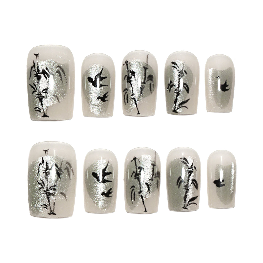 Handcrafted acrylic nails with decorative bird motifs Bowlift