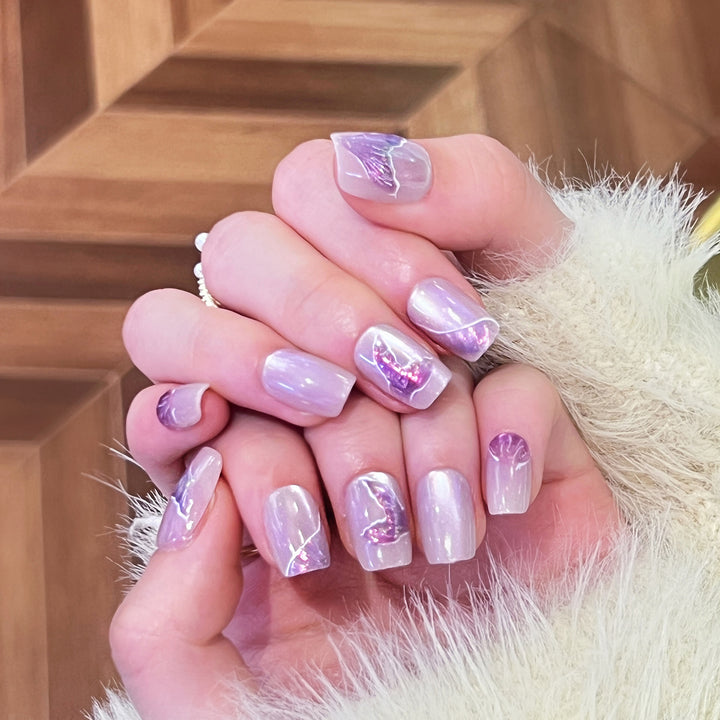 Artfully designed nail extensions with elegant flower motifs Bowlift