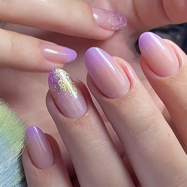 Artful nail art with ombre design and glitter accents Bowlift
