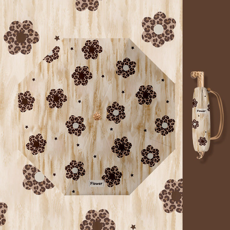Ladies folding umbrella with playful design Bowlift