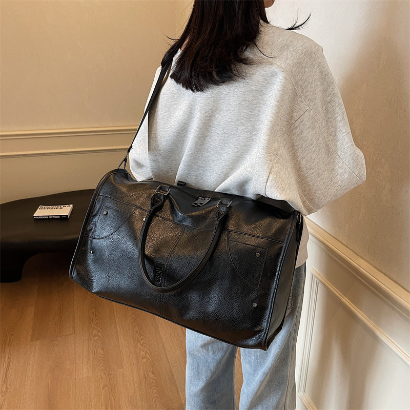 Elegant leather bag with stylish design and versatile carrying options Bowlift