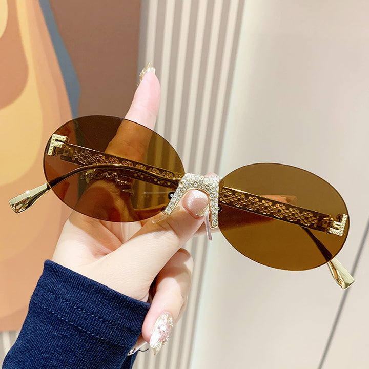 Women's sunglasses with glittering frame and oval lenses Bowlift