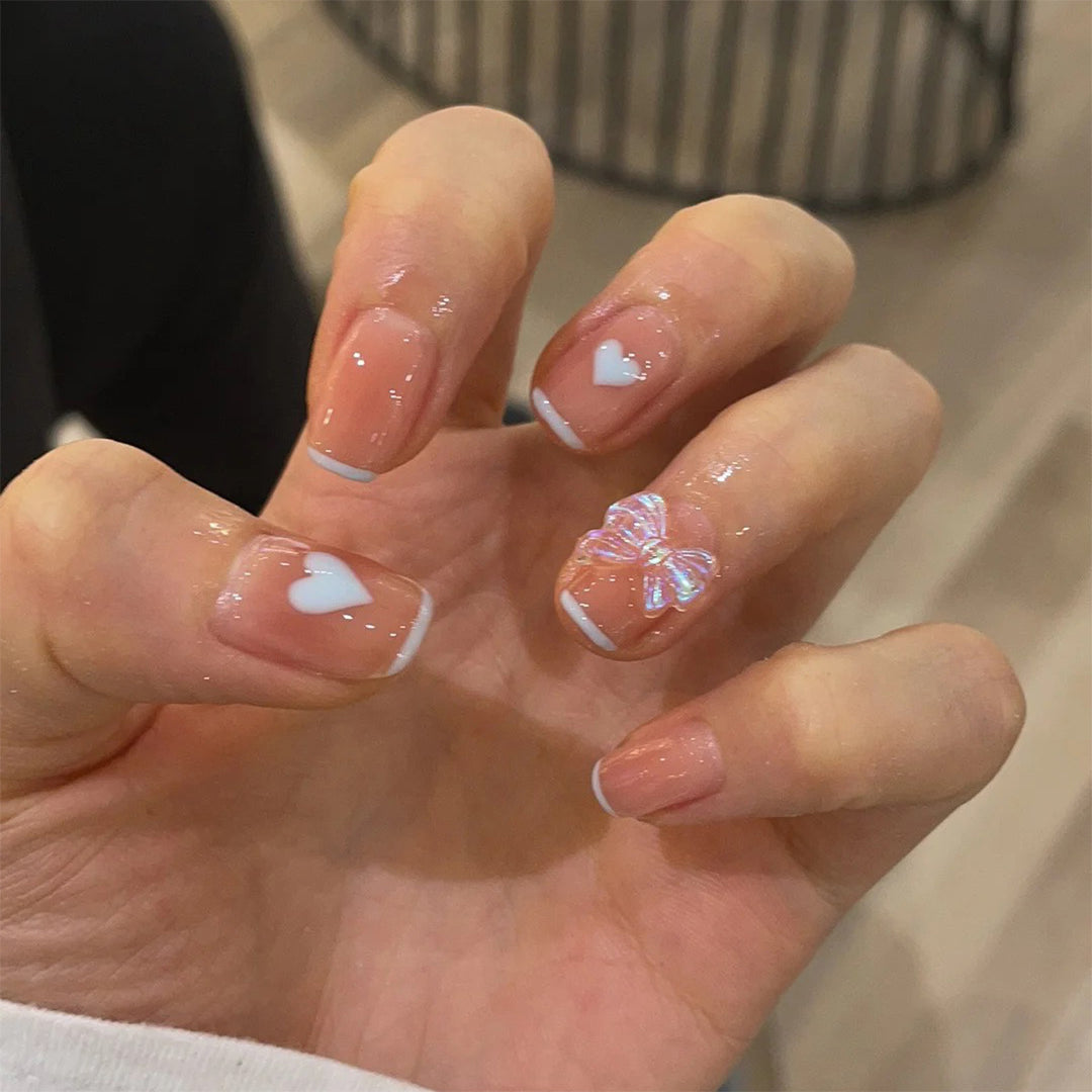 Nail art with heart and butterfly motifs Bowlift