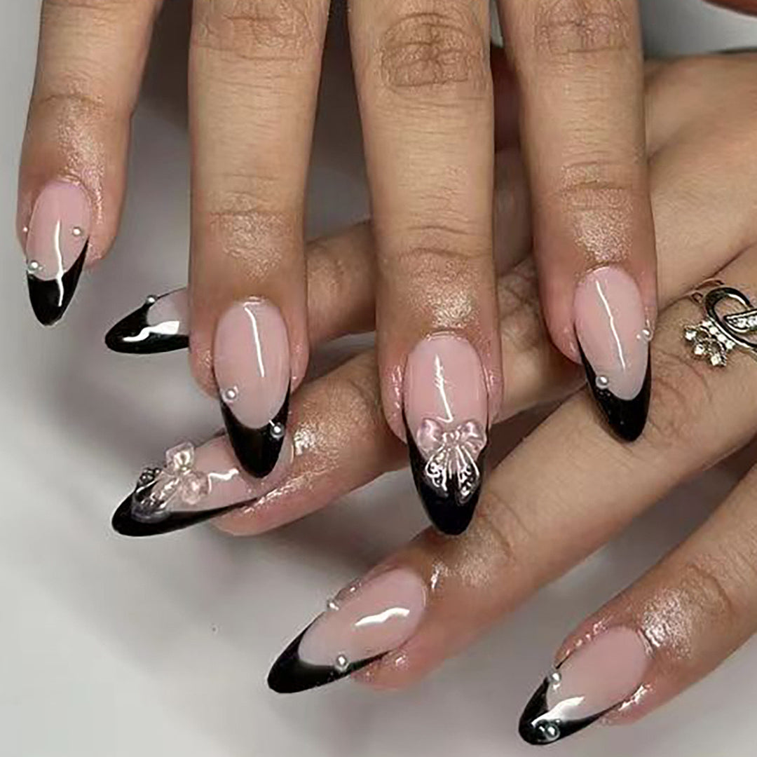 Artificial nail set with glossy French design and delicate 3D accents Bowlift