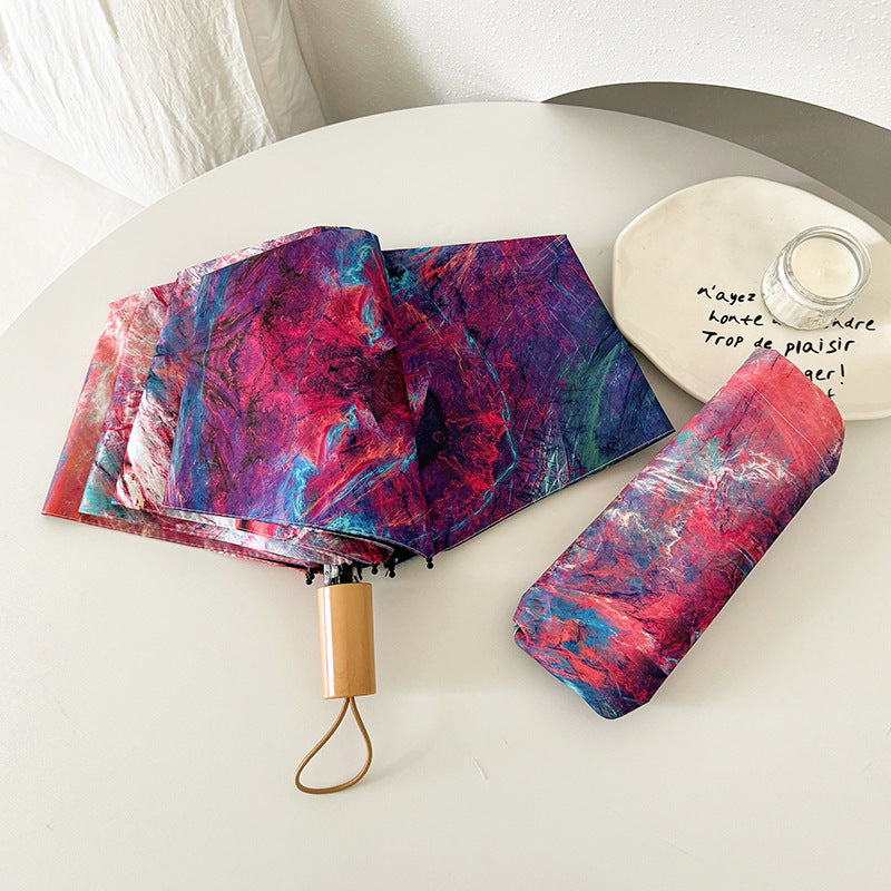 Ladies elegant folding umbrella with unique marble pattern Bowlift