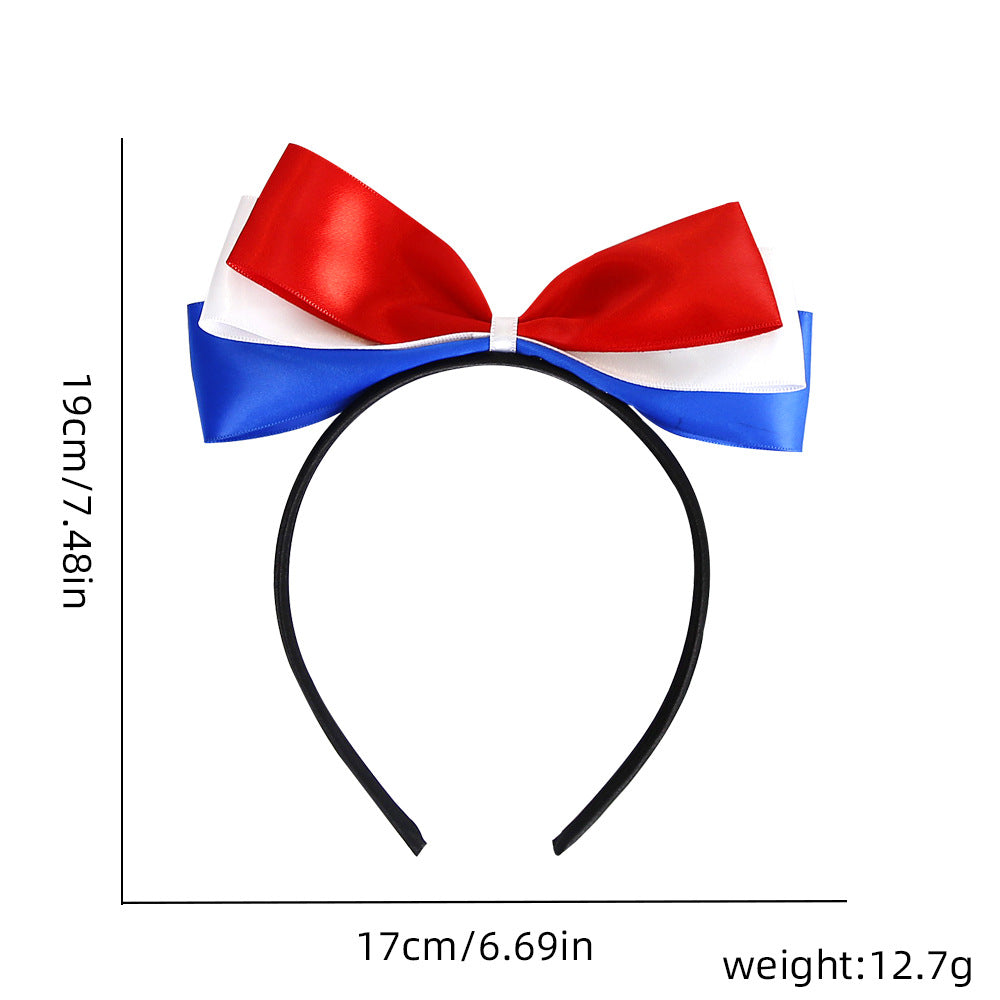 Ladies' festive hairband with pom poms, star embellishments, and glitter tinsel Bowlift