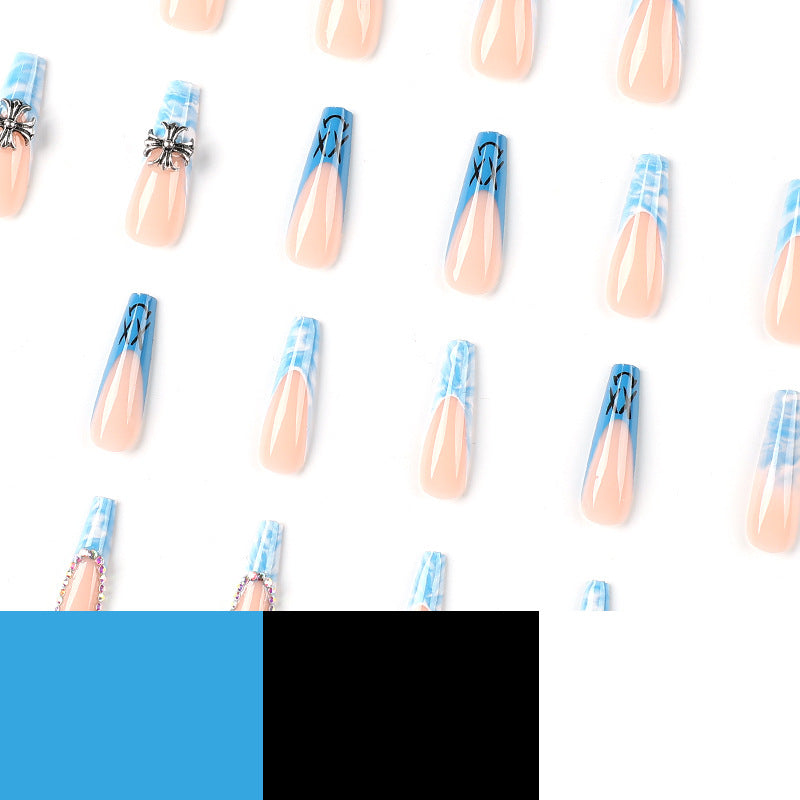 Artistic acrylic nails with marbled design and unique embellishments Bowlift