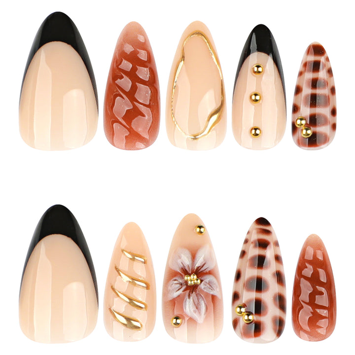 Artificial nails in modern stiletto design with golden accents Bowlift