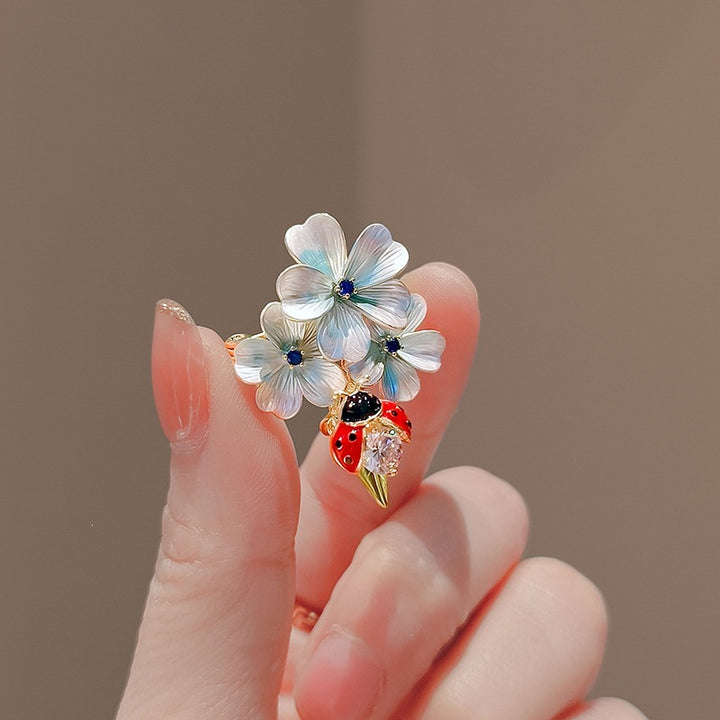 Flower brooch with ladybug and crystal Bowlift