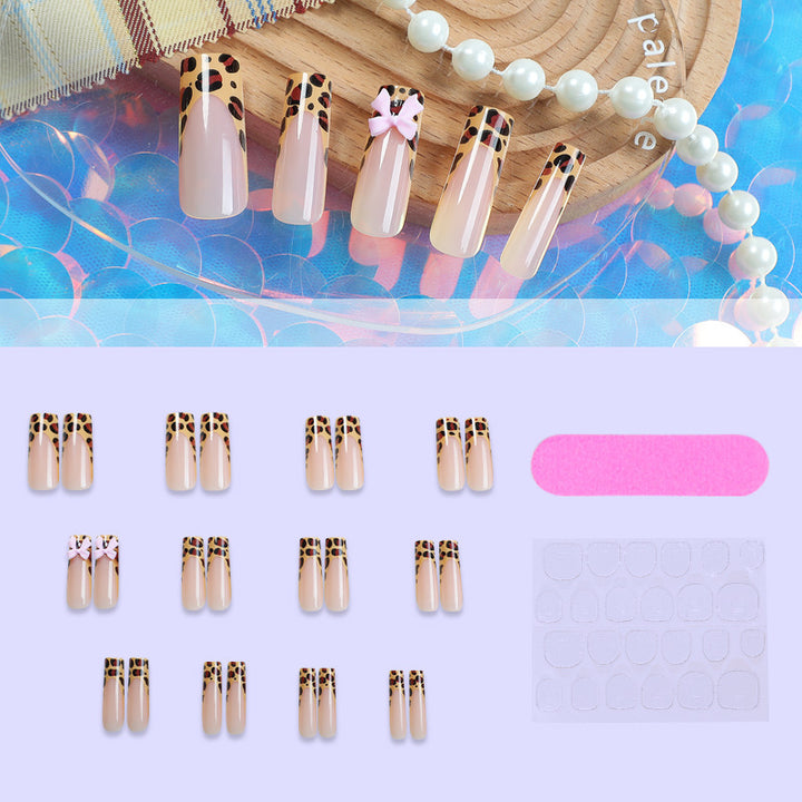 Decorative Stiletto Press-On Nail Art with Animal Print and Bow Accents Bowlift