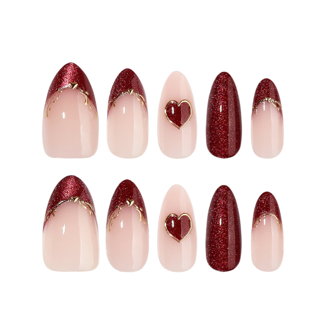 Artful stiletto nails with heart designs and glitter embellishment Bowlift