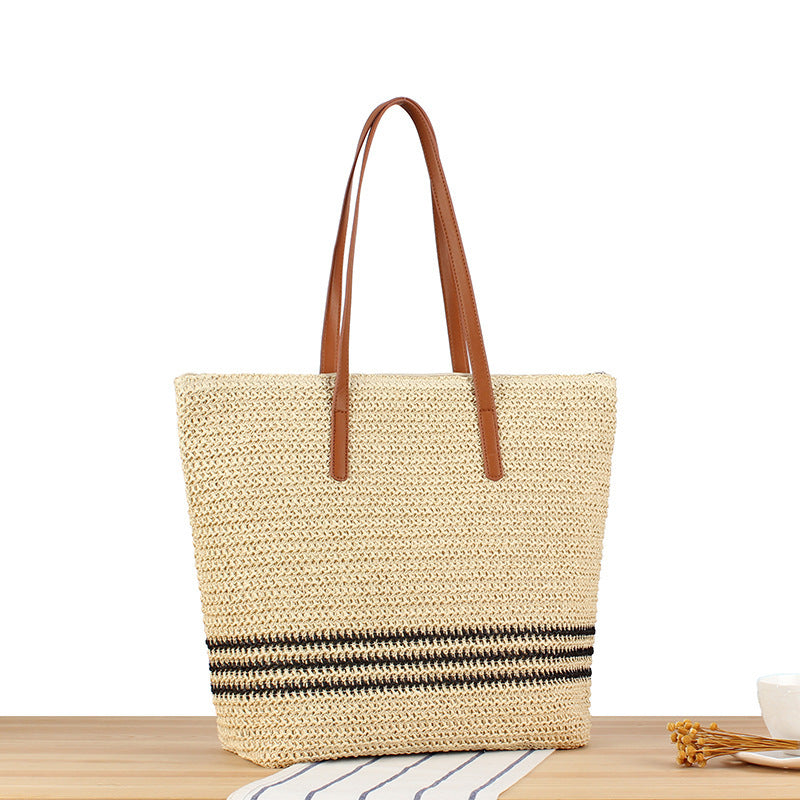 Stylish beach bag made of natural weave with leather handles Bowlift