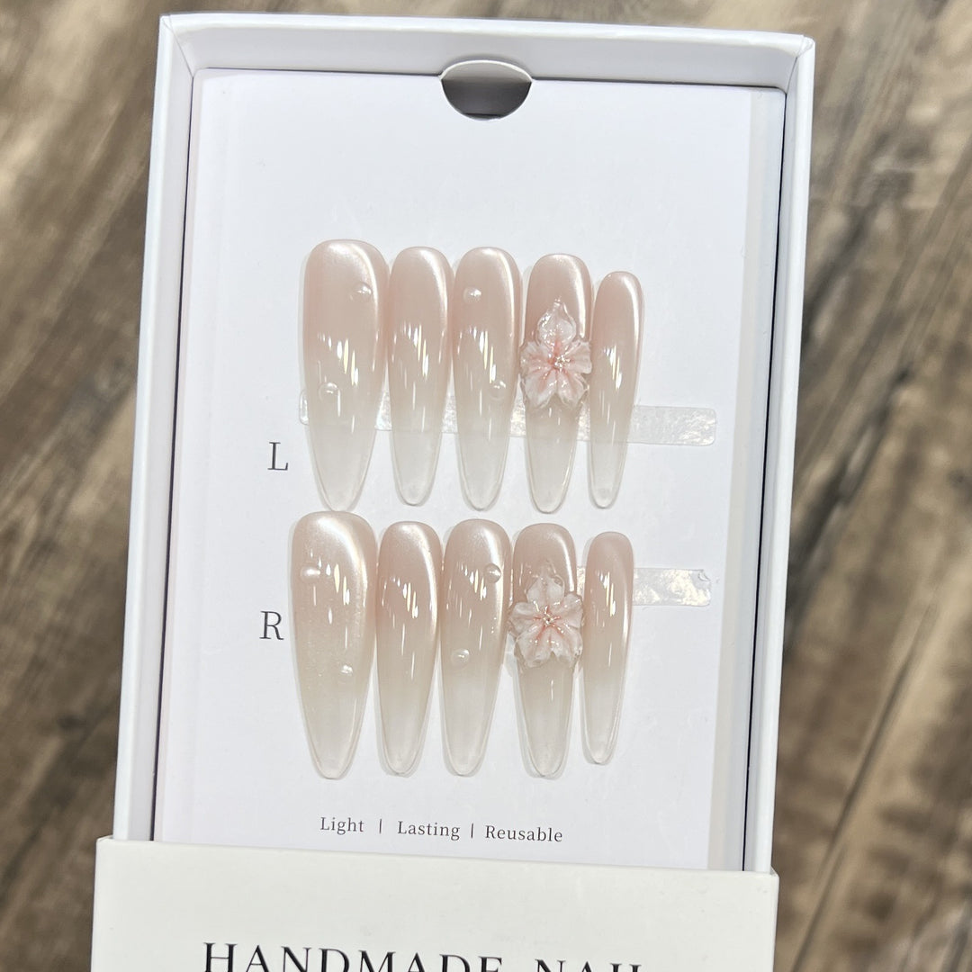 Elegant Stiletto Nail Extensions with Floral Accents Bowlift