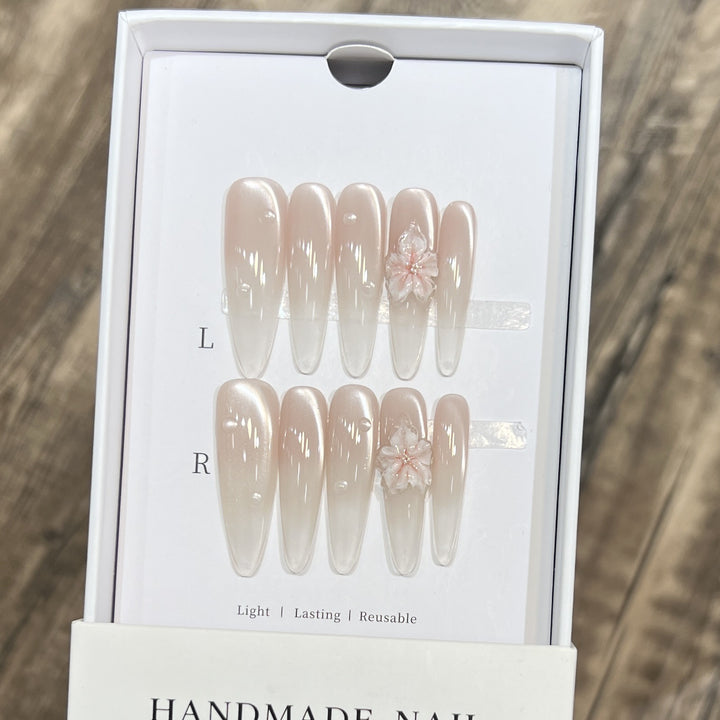 Elegant Stiletto Nail Extensions with Floral Accents Bowlift