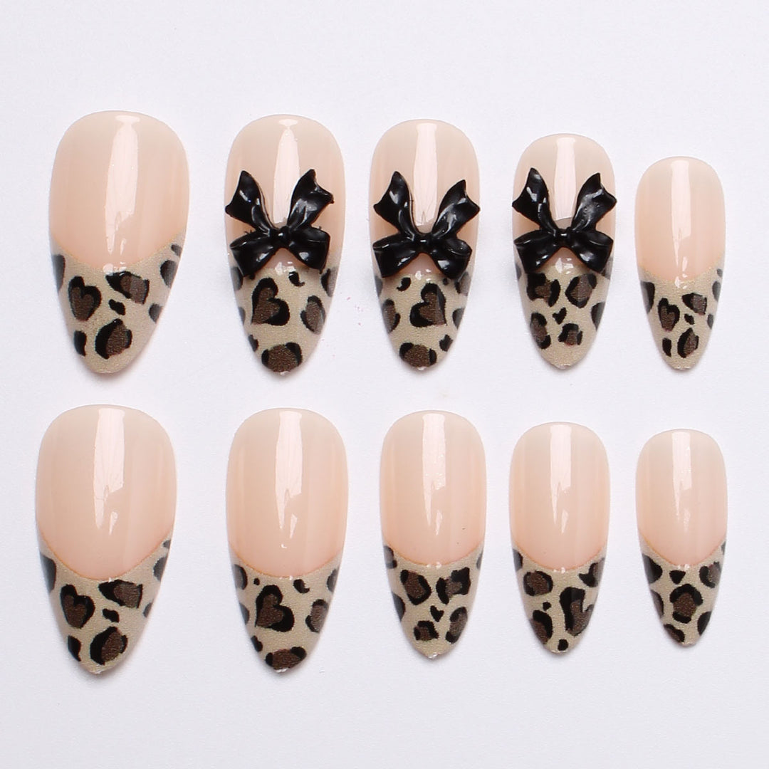 Creative artificial nails with stylish leopard pattern and bow accents Bowlift
