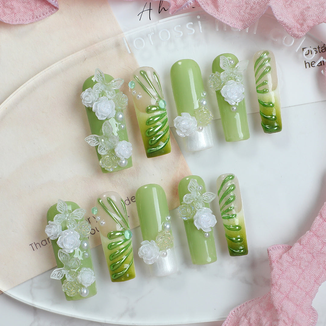 Creative nail set with floral design and delicate accents Bowlift