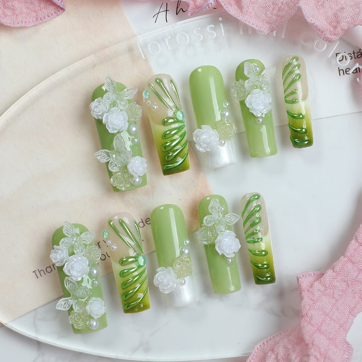 Creative nail set with floral design and delicate accents Bowlift