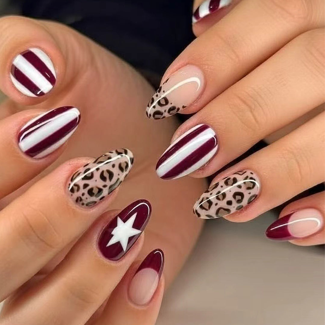 Artful stiletto nails with leopard pattern and elegant glitter decoration Bowlift