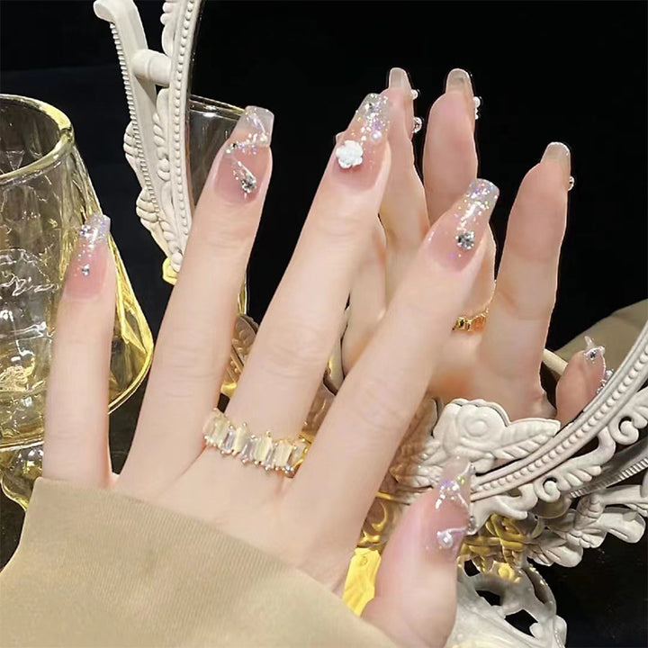 Artificial nails with heart accent and glamorous decorations Bowlift