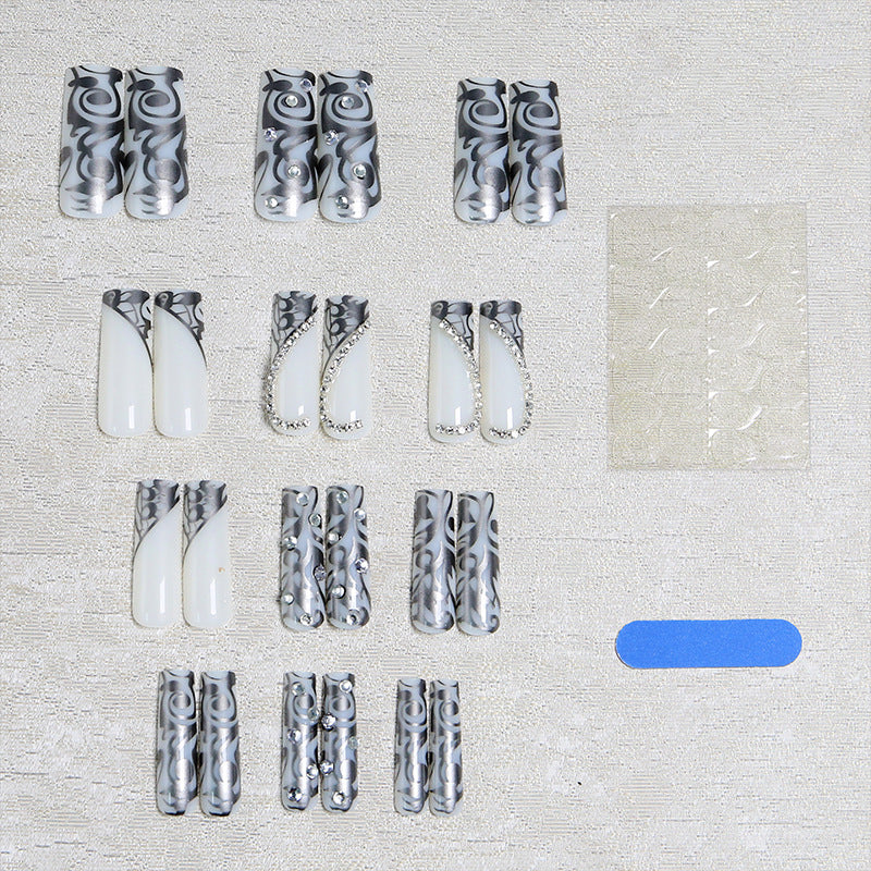 Acrylic nail set with elegant patterns and sparkling accents Bowlift