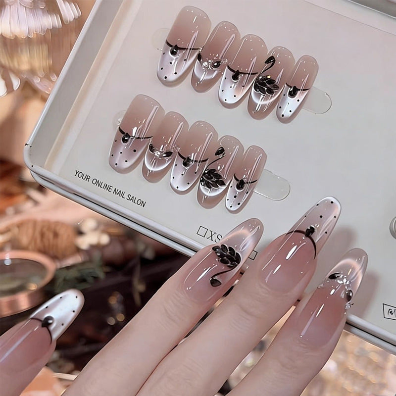 Artificial nail set with festive gift design and elegant glitter accents Bowlift